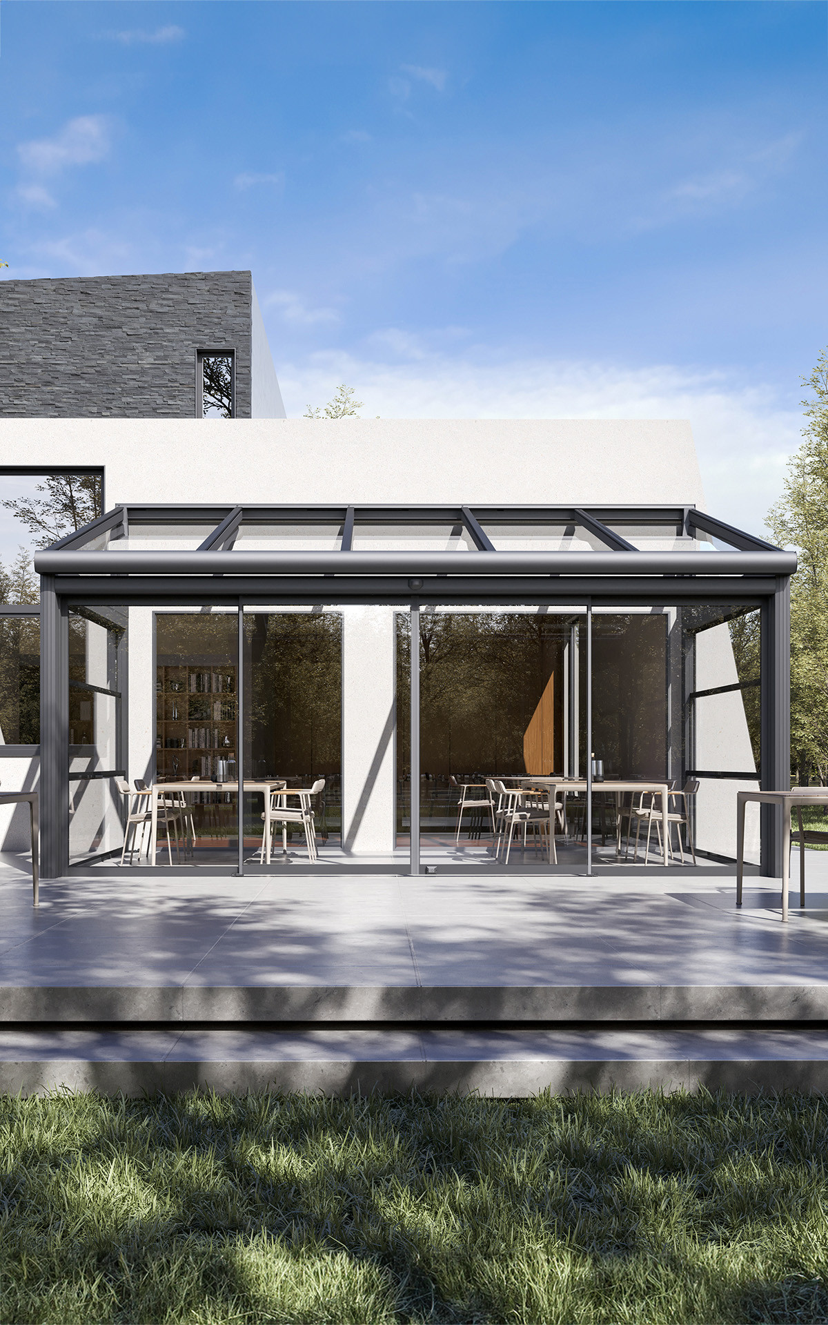 A contemporary house with a functional Winter Garden featuring a patio and a glass roof.